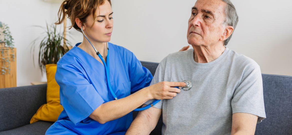 A photo of a patient with Alzheimer's with a hospice nurse