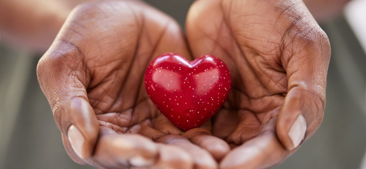 Photo of individual holding a heart