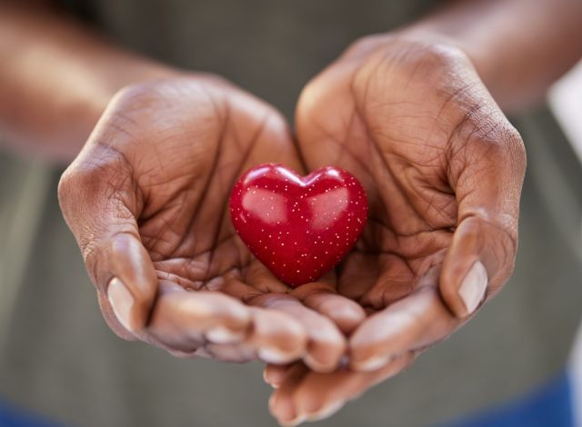 Photo of individual holding a heart