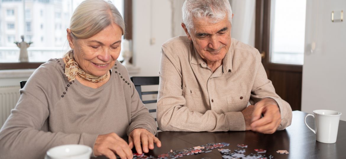 Senior Couple Doing A Jigsaw Puzzle Together